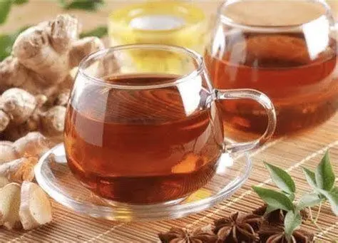 Khasiat Jahe Merah Rebusan jahe merah dalam cangkir